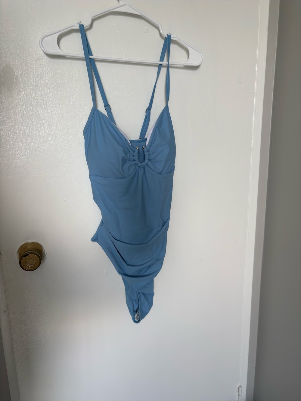 Woman’s Blue One-Piece Swimsuit with Adjustable Crisscross Straps